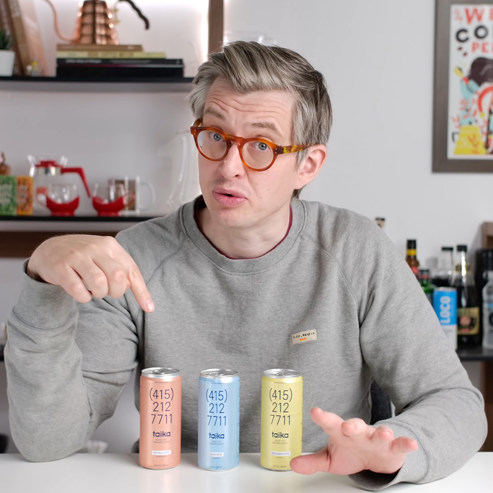 James Hoffmann pointing at Taika cans